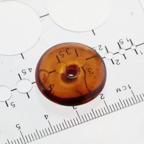 Donut shape Baltic amber pendant medallion